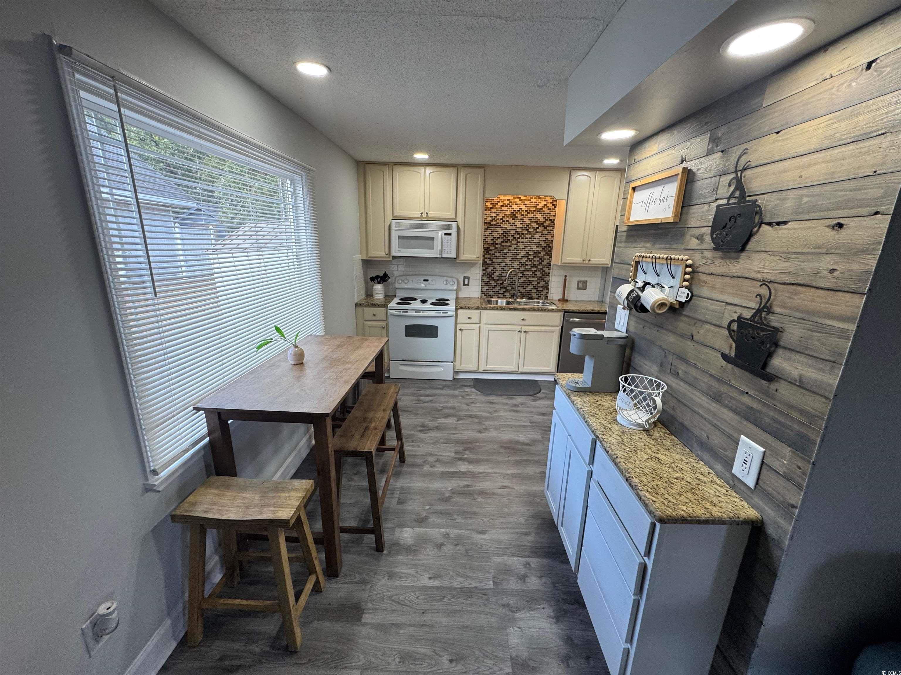 1960 Lake View Circle Surfside Beach, SC 29575 - Photo 11 of 40 Kitchen featuring a coffee station and dining area