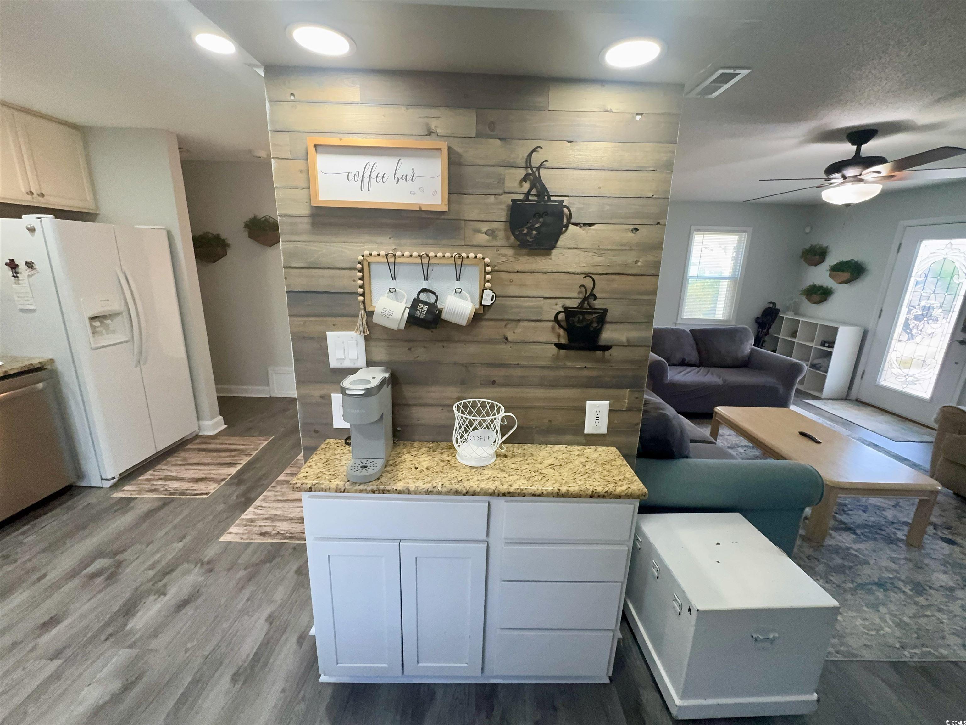 1960 Lake View Circle Surfside Beach, SC 29575 - Photo 12 of 40 Living area featuring a coffee station and ascent wall