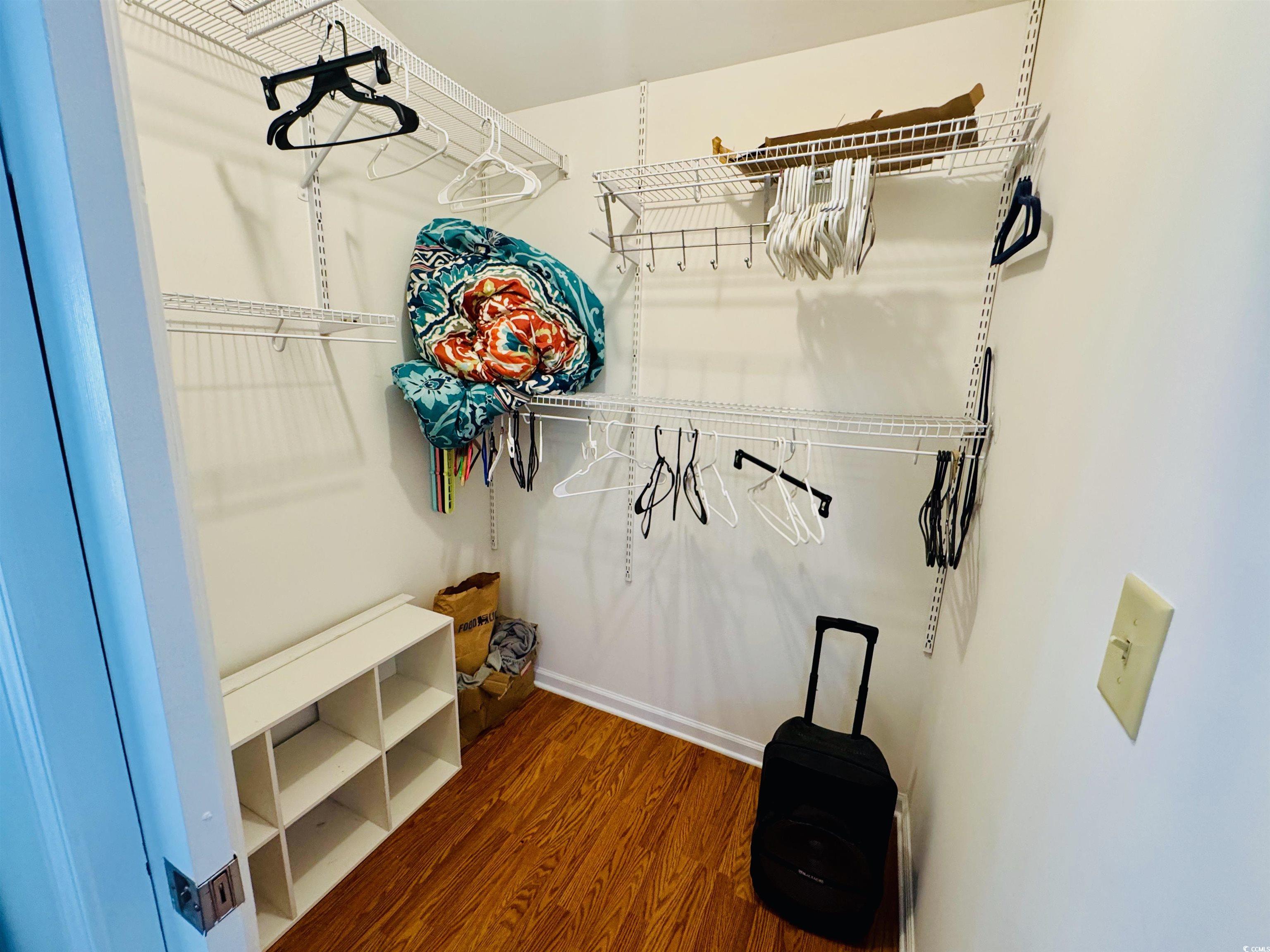 1960 Lake View Circle Surfside Beach, SC 29575 - Photo 22 of 40 Walk in closet featuring dark wood-type flooring