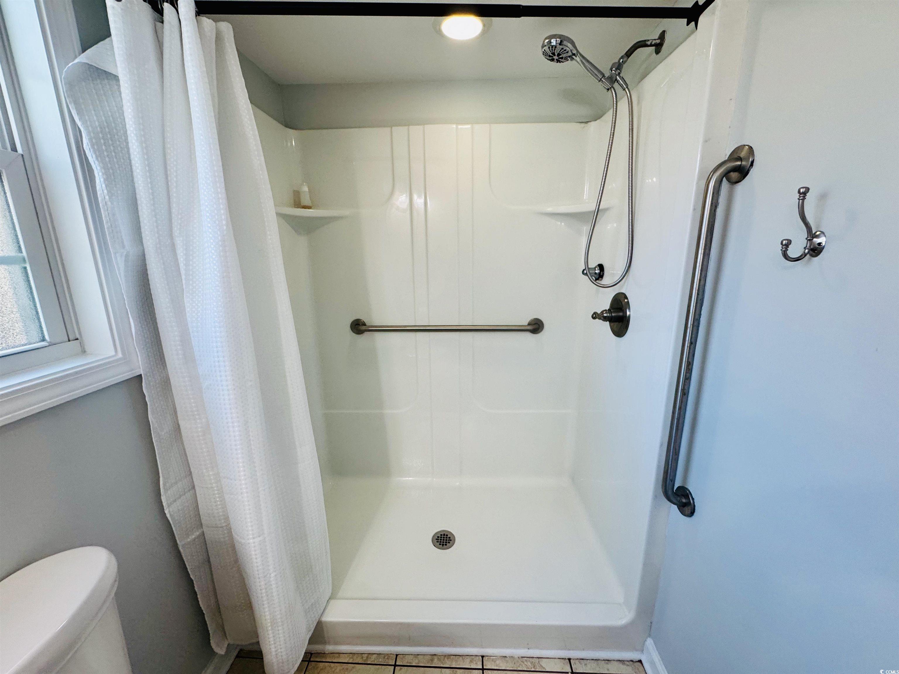 1960 Lake View Circle Surfside Beach, SC 29575 - Photo 24 of 40 Full bath featuring a shower stall and tile patterned flooring