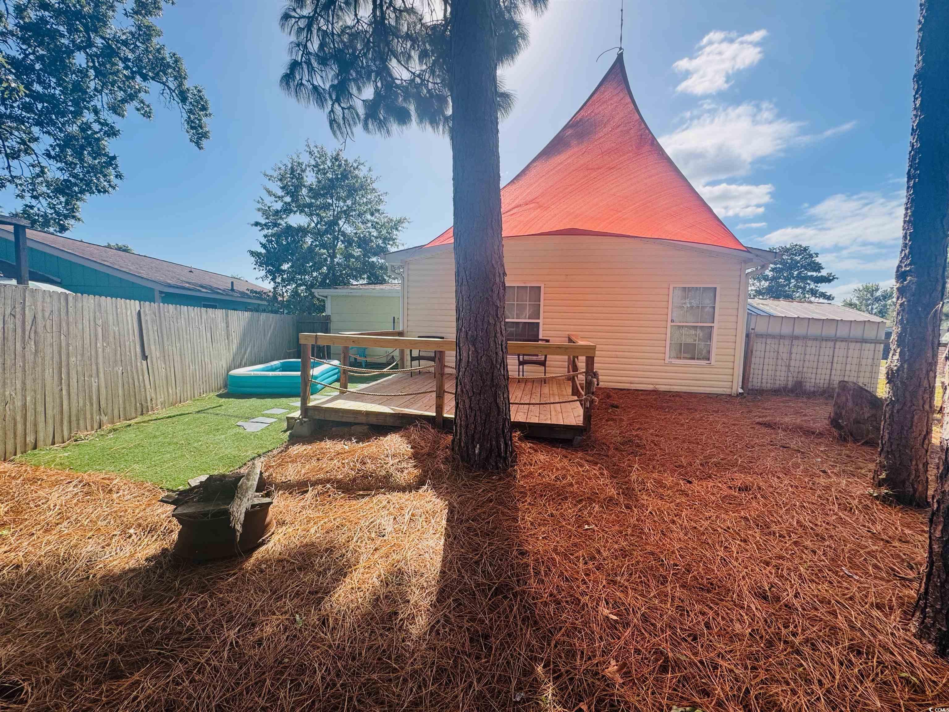 1960 Lake View Circle Surfside Beach, SC 29575 - Photo 40 of 40 Fenced backyard with a deck