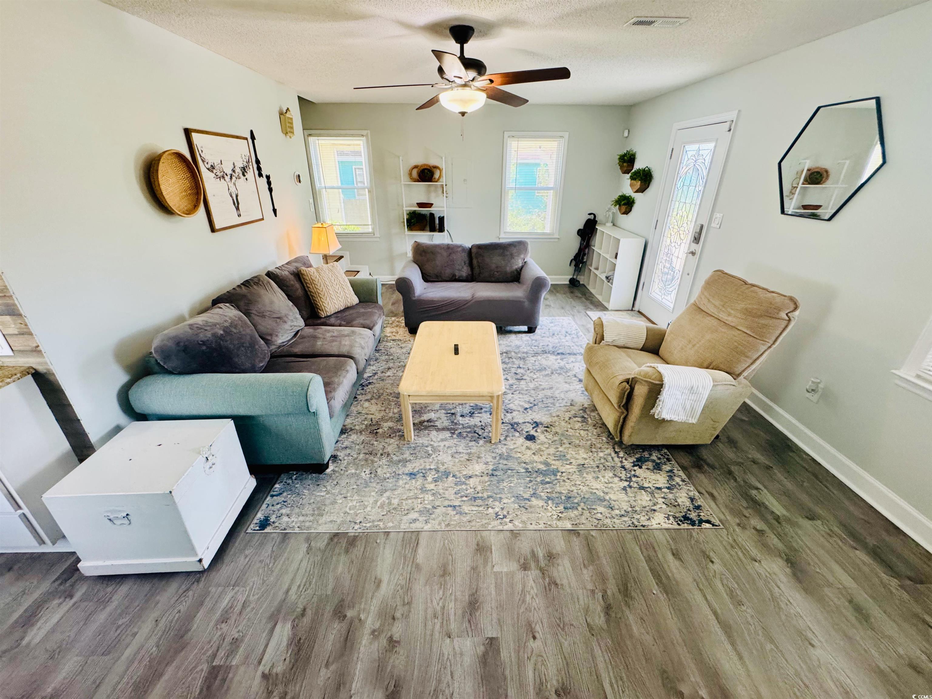 1960 Lake View Circle Surfside Beach, SC 29575 - Photo 8 of 40 Living area with a ceiling fan, and wood finished floors