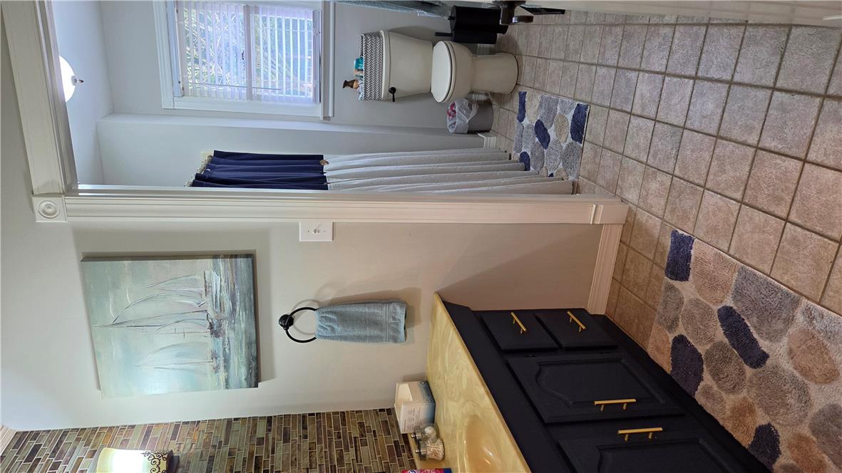 3733 Viewpoint Court Slatington, PA 18080 - Photo 14 of 25 A well-lit bathroom features a modern vanity and practical tiled flooring.