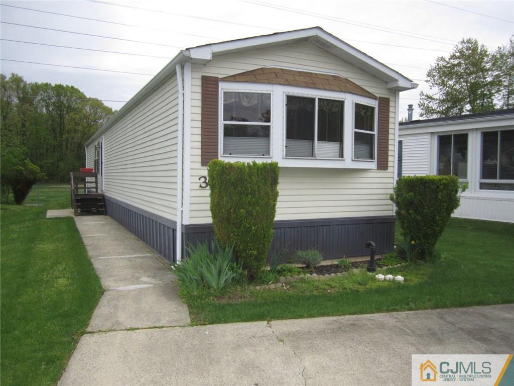 36 Whitman Road, Unit 1 North Brunswick, NJ 08902 - Photo 1 of 18 a front view of a house with garden