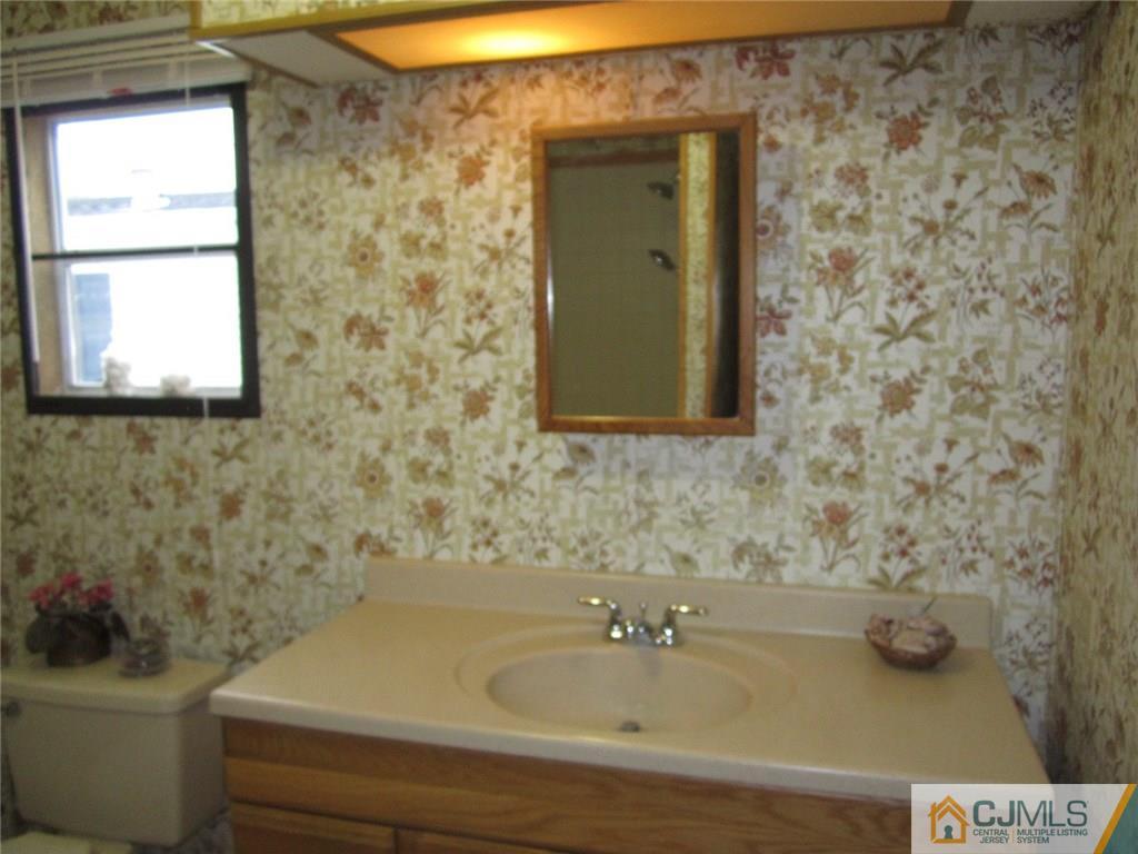 36 Whitman Road, Unit 1 North Brunswick, NJ 08902 - Photo 14 of 18 a bathroom with a sink and a bathtub