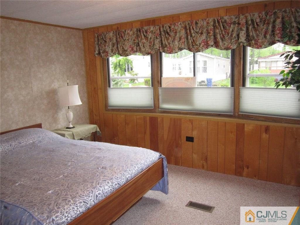 36 Whitman Road, Unit 1 North Brunswick, NJ 08902 - Photo 17 of 18 a bedroom with a bed and a window