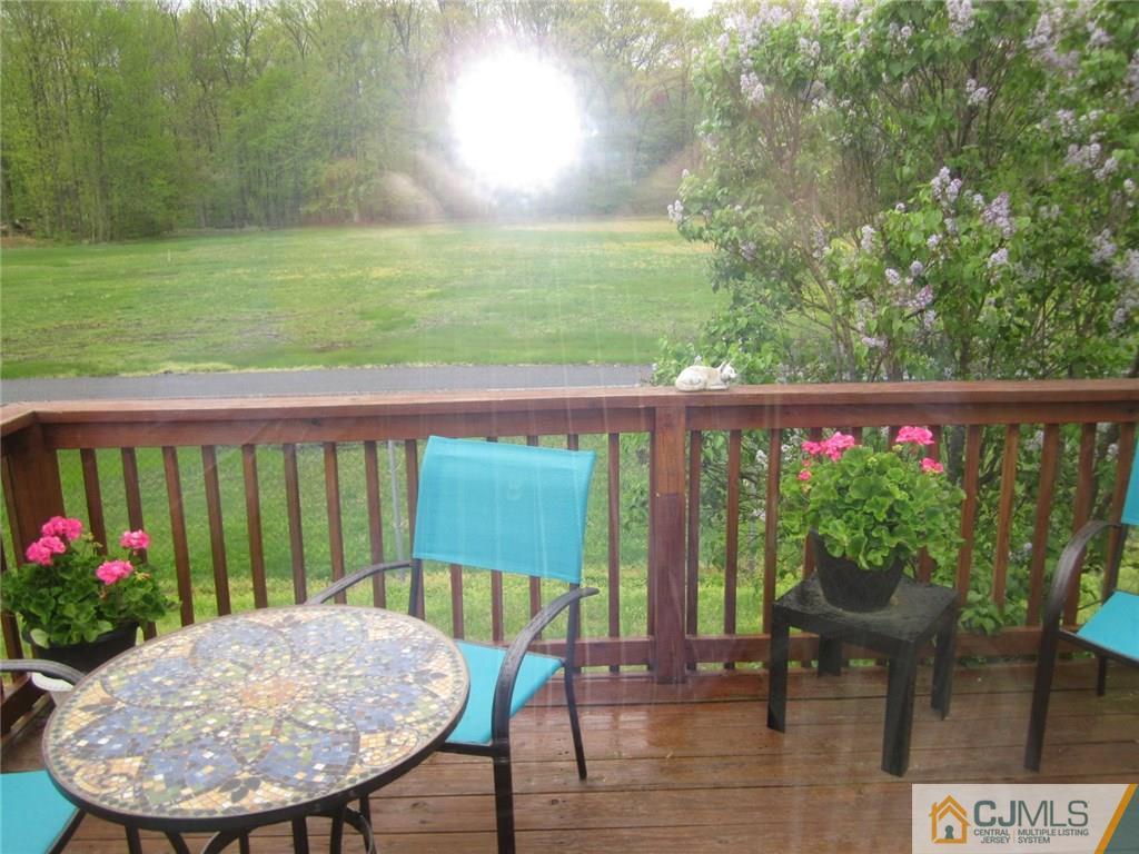 36 Whitman Road, Unit 1 North Brunswick, NJ 08902 - Photo 3 of 18 a view of a chairs and table in the patio