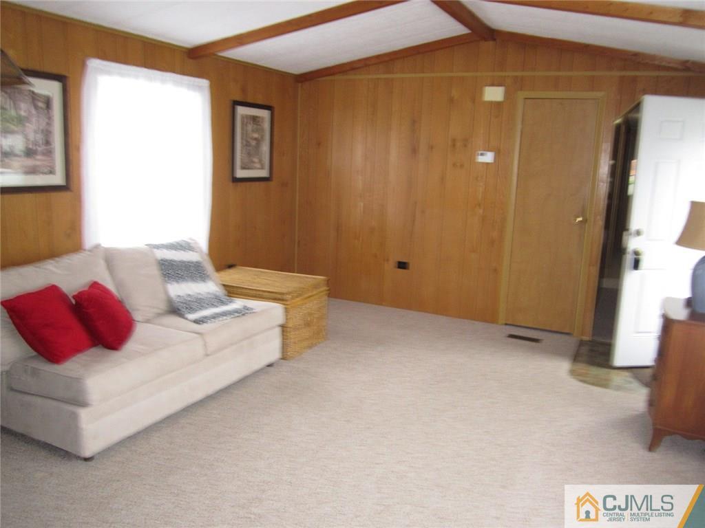 36 Whitman Road, Unit 1 North Brunswick, NJ 08902 - Photo 5 of 18 a bedroom with a bed and couch