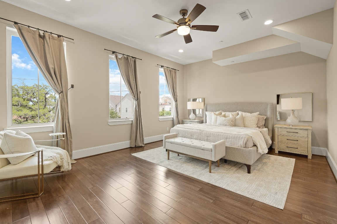 1812 Rosedale Street, Unit A Houston, TX 77004 - Photo 11 of 21 Oversized primary suite with room for a king bed and sitting area, framed by unobstructed views.