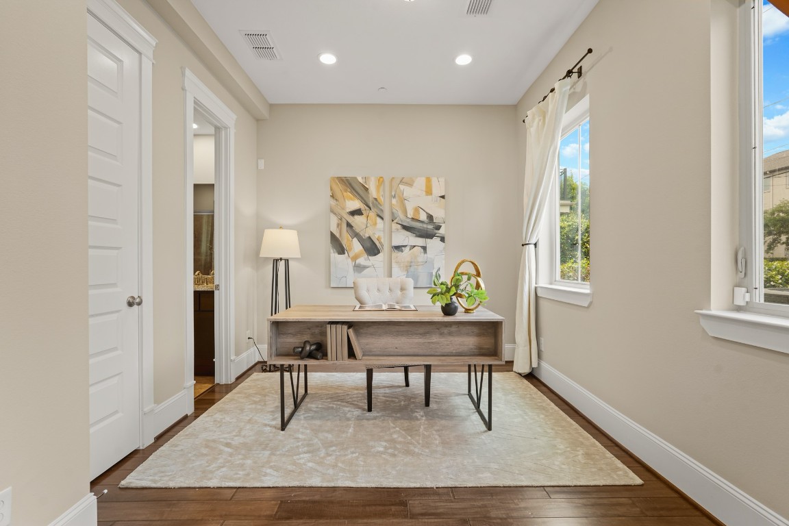1812 Rosedale Street, Unit A Houston, TX 77004 - Photo 4 of 21 Versatile first-floor suite—ideal as a private office or third bedroom, complete with ensuite bath.