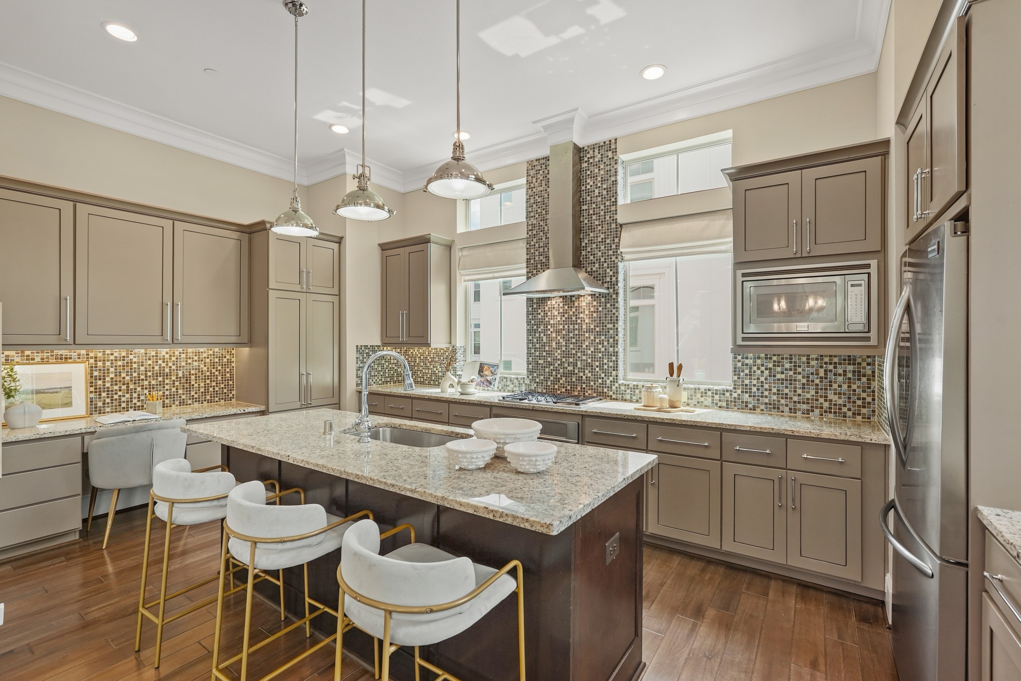 1812 Rosedale Street, Unit A Houston, TX 77004 - Photo 5 of 21 Bright, functional kitchen with breakfast bar and dedicated workspace—designed for real life.