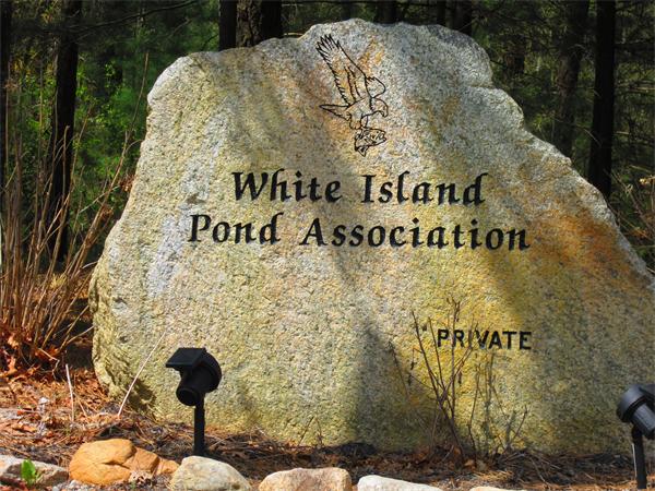 30 Sandy Beach Road Plymouth, MA 02360 - Photo 26 of 26 a sign on the side of a building