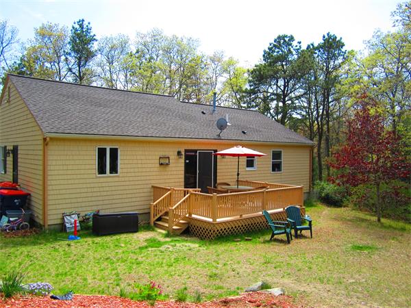 30 Sandy Beach Road Plymouth, MA 02360 - Photo 3 of 26 a backyard of a house with table and chairs