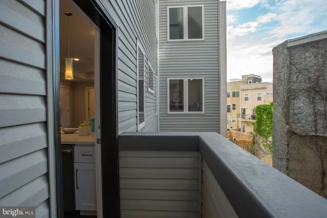 a view of balcony with furniture