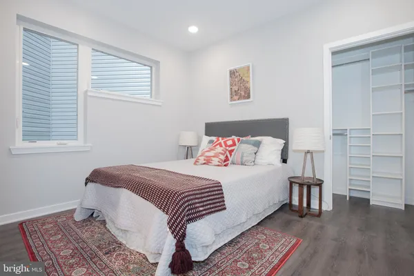 a bedroom with a bed and a walk in closet