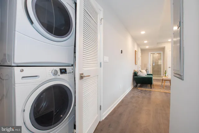 a view of a hallway with washer and dryer