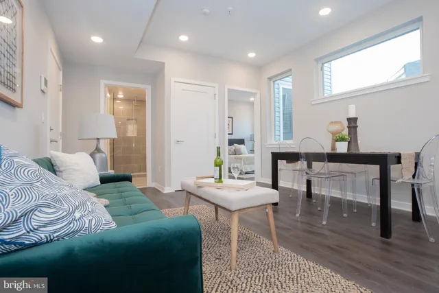 a bedroom with furniture and a wooden floor