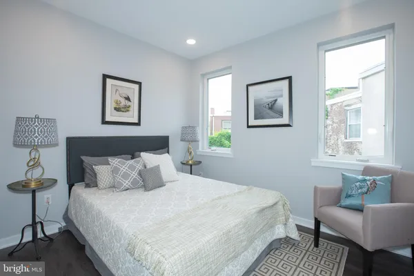 a bedroom with a bed and a couch