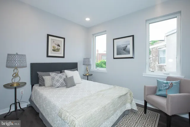 a bedroom with a bed and a couch