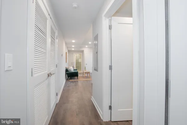 a view of a hallway with a white walls