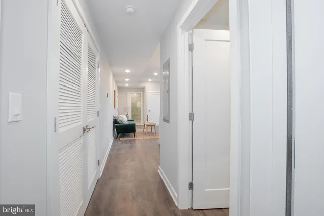 a view of a hallway with a white walls