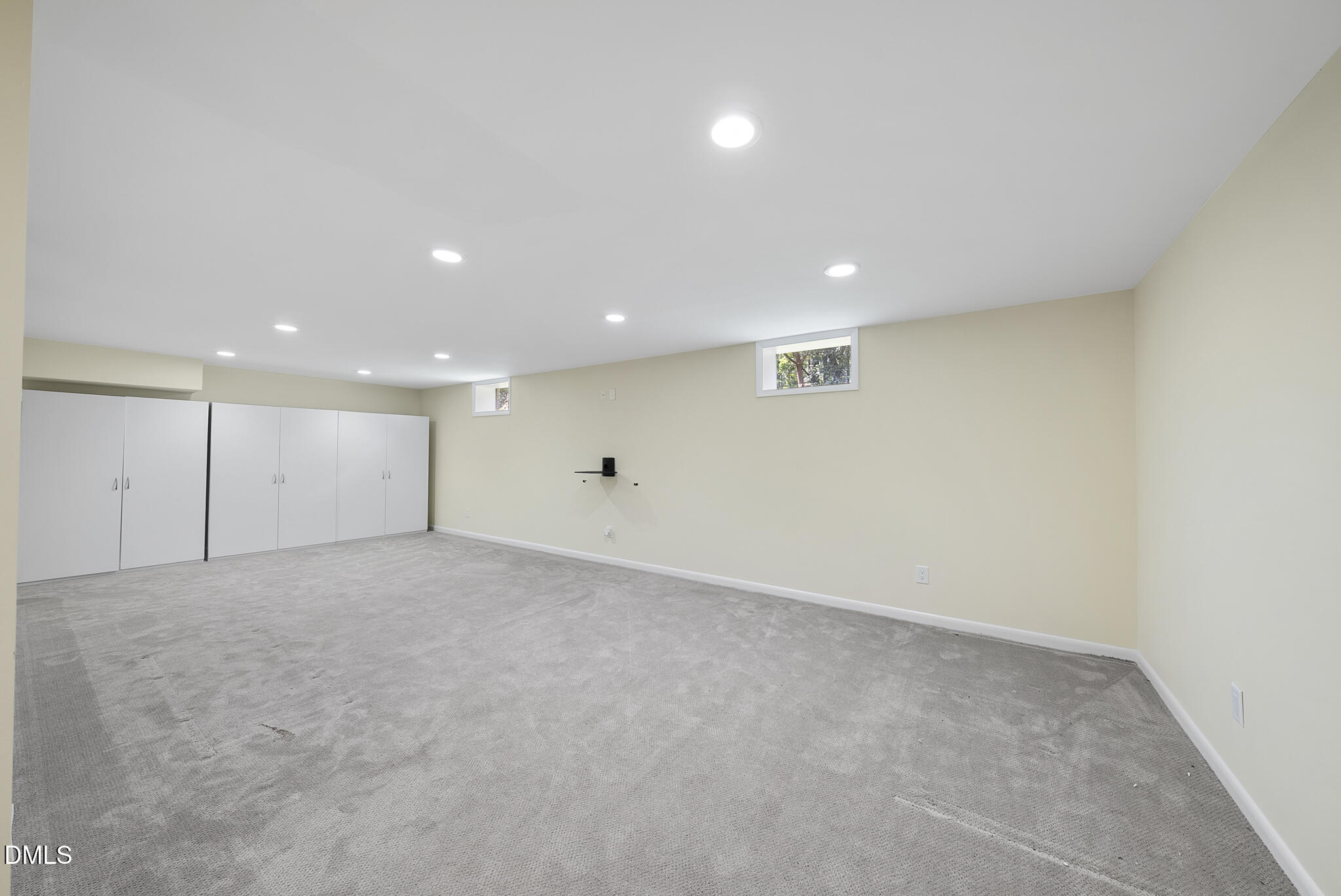 1605 Ridge Road Raleigh, NC 27607 - Photo 33 of 34 an empty room with a ceiling fan and windows
