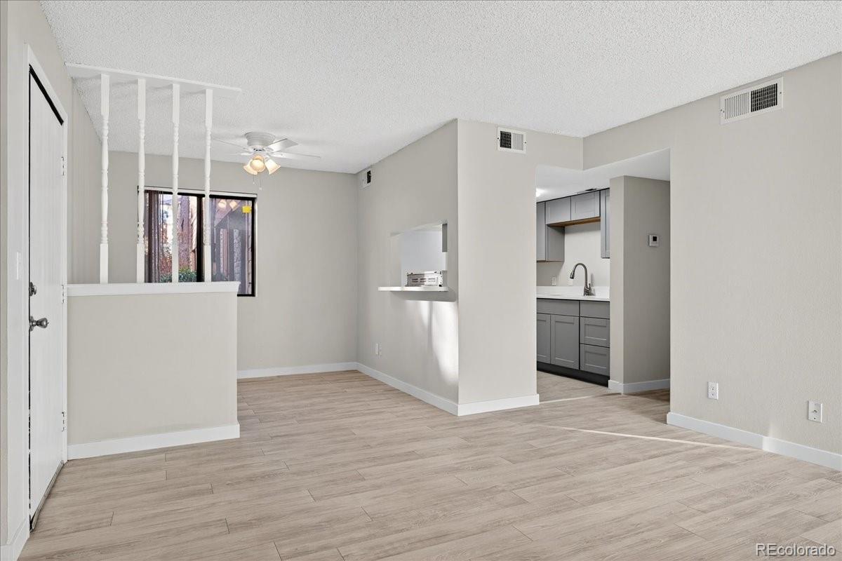 4681 South Decatur Street, Unit 124 Englewood, CO 80110 - Photo 15 of 33 a view of a kitchen with a refrigerator and a window