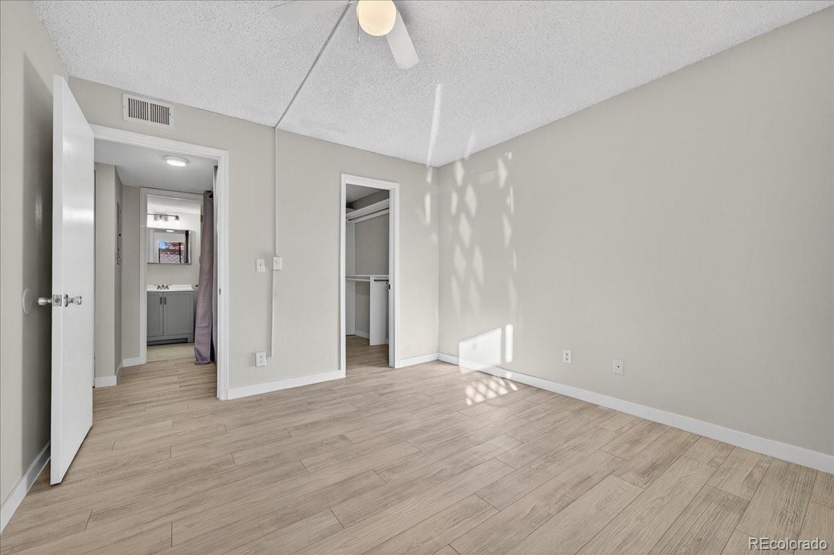 4681 South Decatur Street, Unit 124 Englewood, CO 80110 - Photo 24 of 33 wooden floor in an empty room