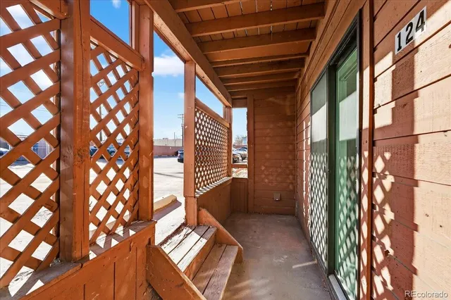 a view of entryway with paintings on the wall