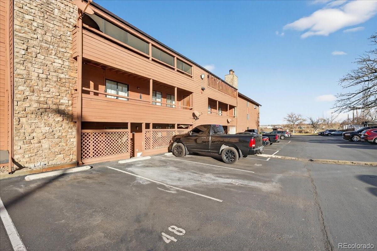4681 South Decatur Street, Unit 124 Englewood, CO 80110 - Photo 31 of 33 a view of a cars park in front of a building