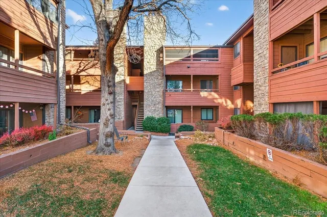 a front view of a building with a yard