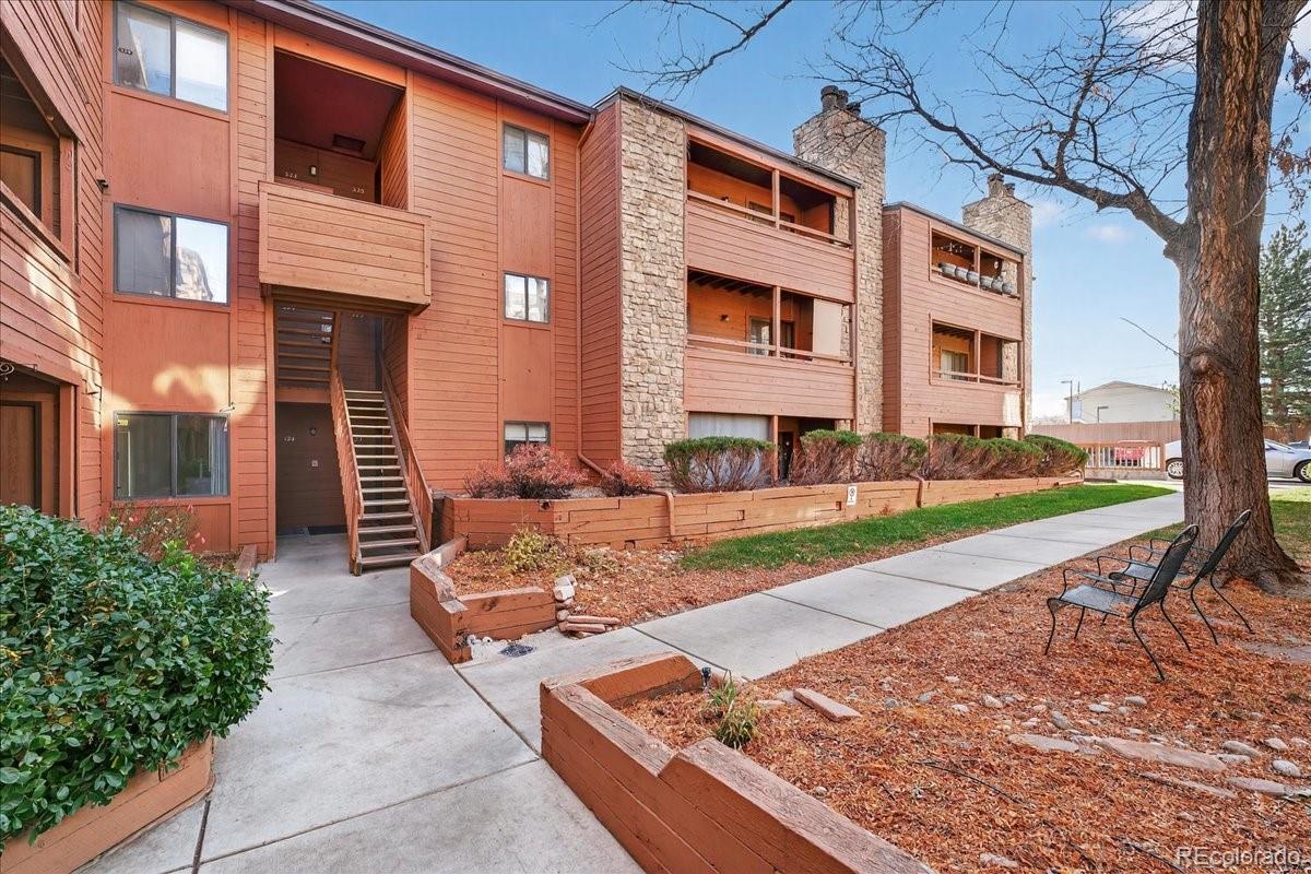 4681 South Decatur Street, Unit 124 Englewood, CO 80110 - Photo 5 of 33 a front view of a house with garden