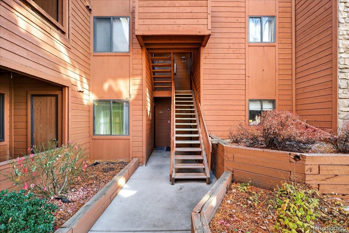 4681 South Decatur Street, Unit 124 Englewood, CO 80110 - Photo 6 of 33 a front view of a house with a yard