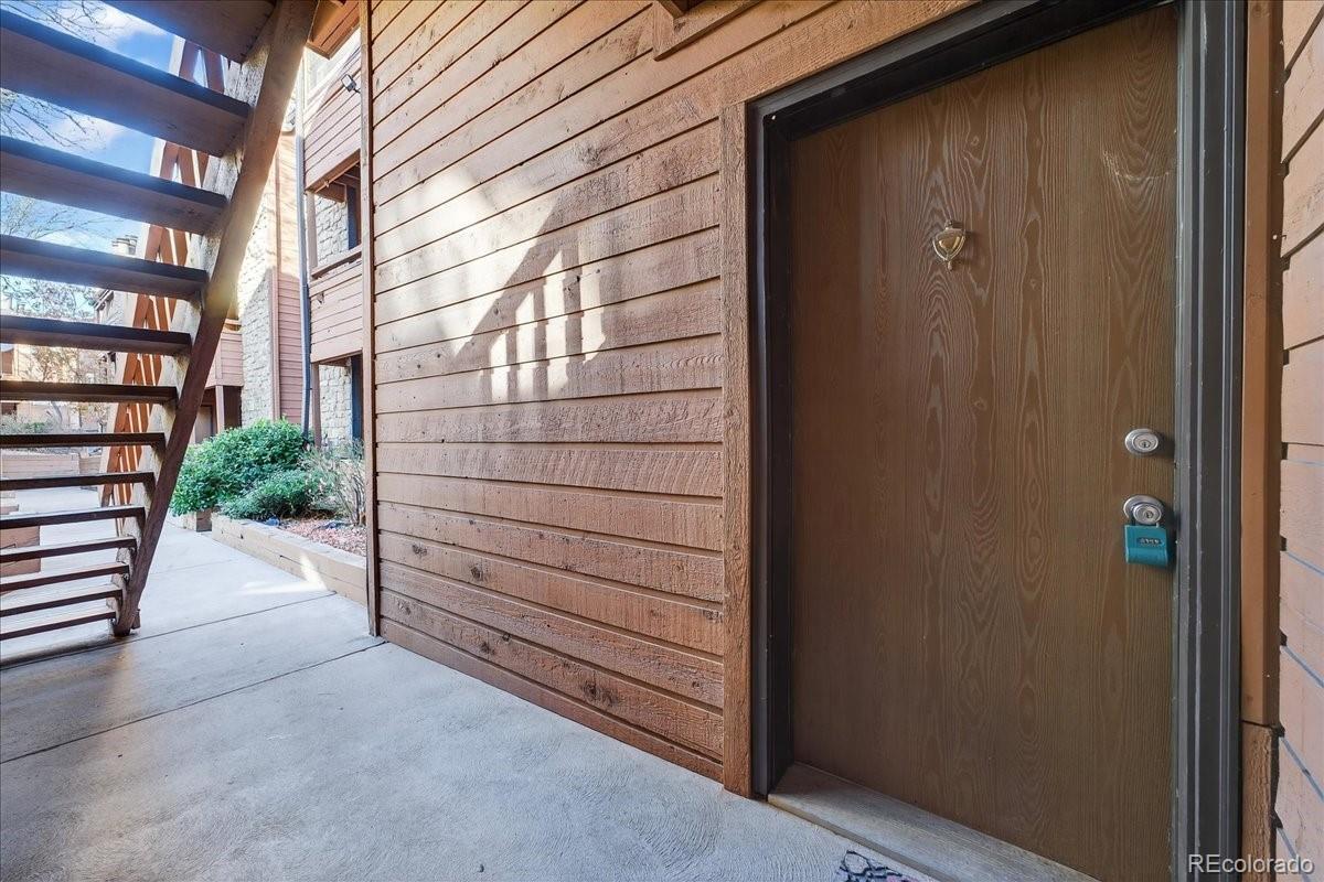 4681 South Decatur Street, Unit 124 Englewood, CO 80110 - Photo 7 of 33 a view of a wooden door and a window