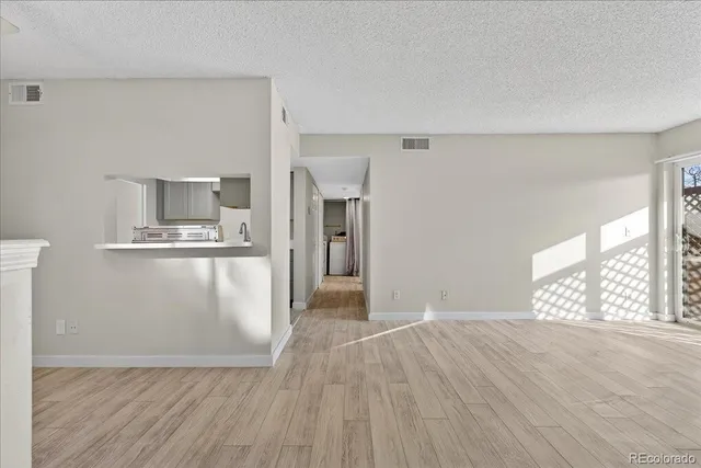 a view of kitchen with furniture and wooden floor