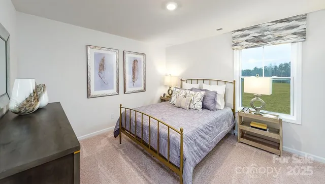 a bedroom with a bed and window