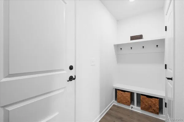a kitchen with stainless steel appliances granite countertop a sink a stove and chairs