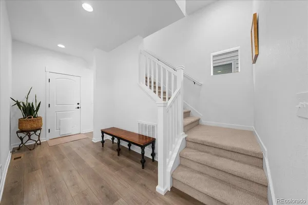 a kitchen with stainless steel appliances granite countertop a sink a stove and a microwave