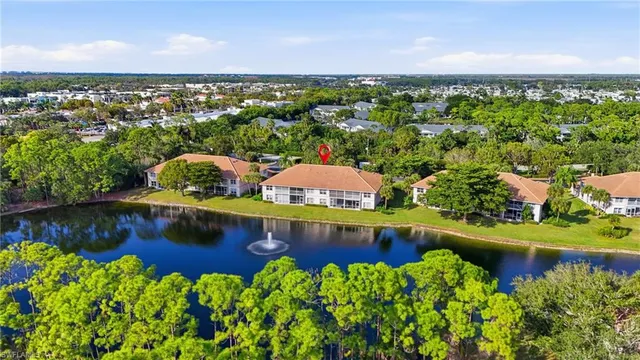 an aerial view of a house with a lake view