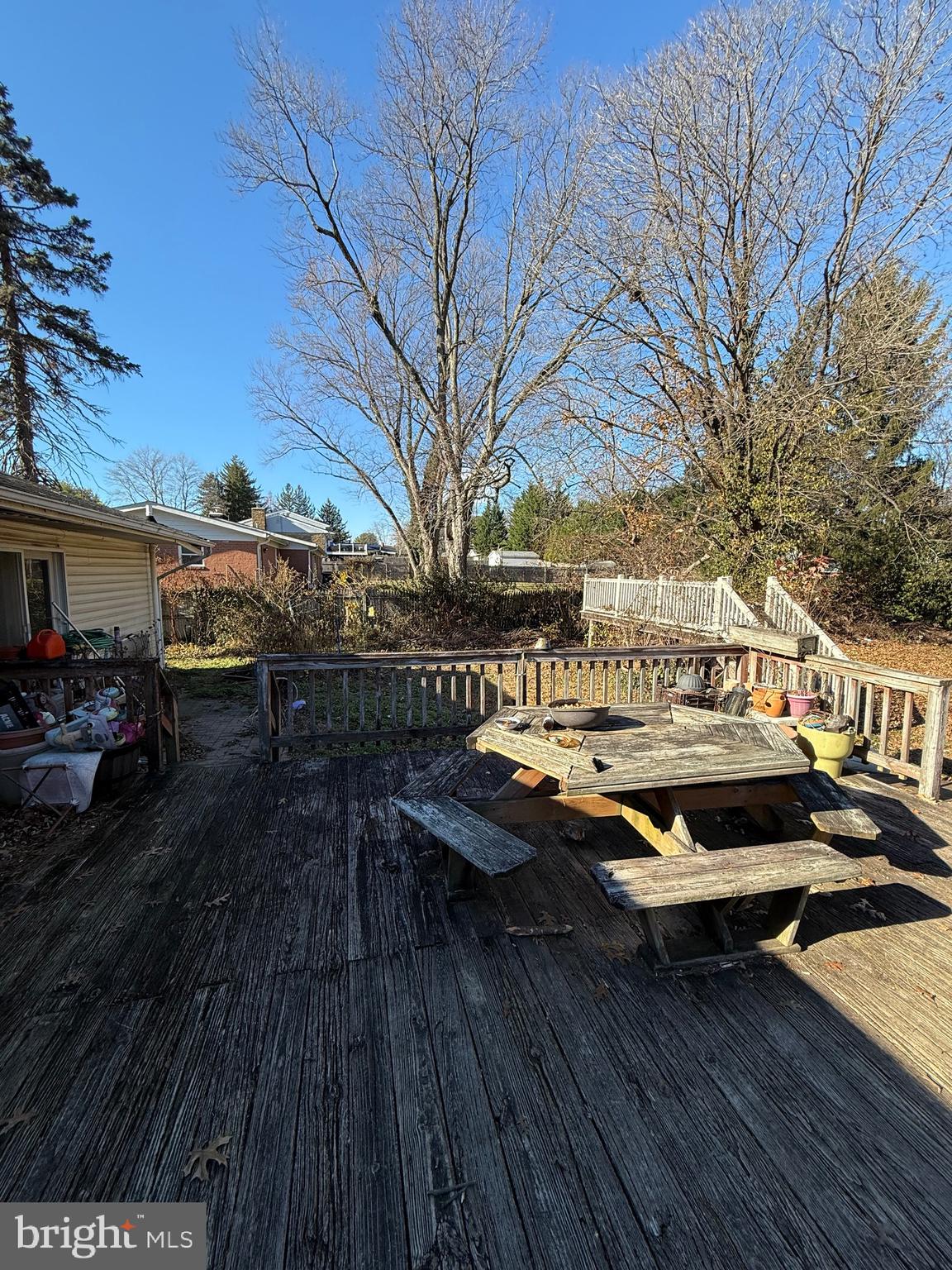 1400 Spencerville Road Spencerville, MD 20868 - Photo 15 of 16 a view of balcony with wooden floor and outdoor seating