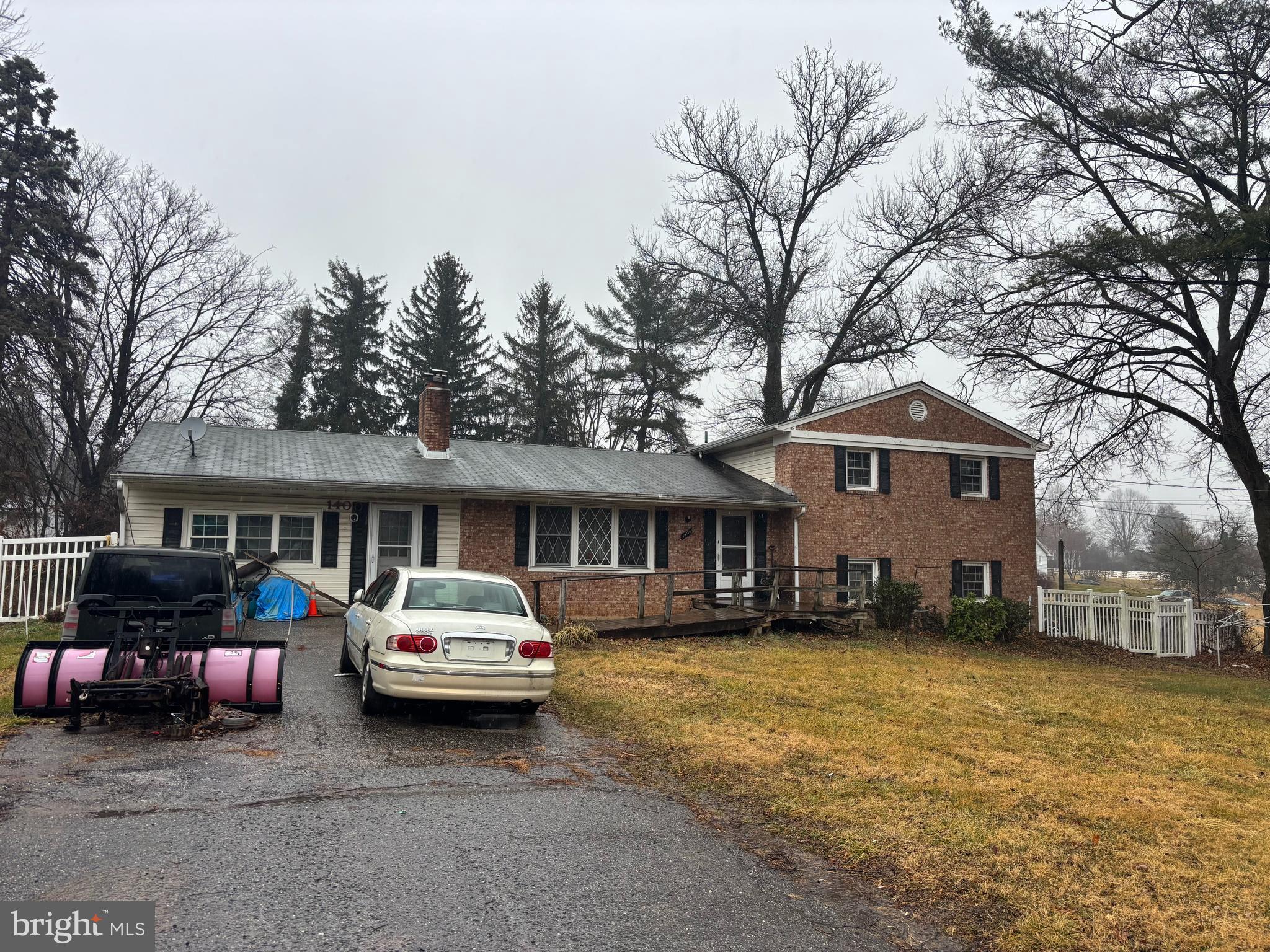 1400 Spencerville Road Spencerville, MD 20868 - Photo 2 of 16 a car parked in front of a house