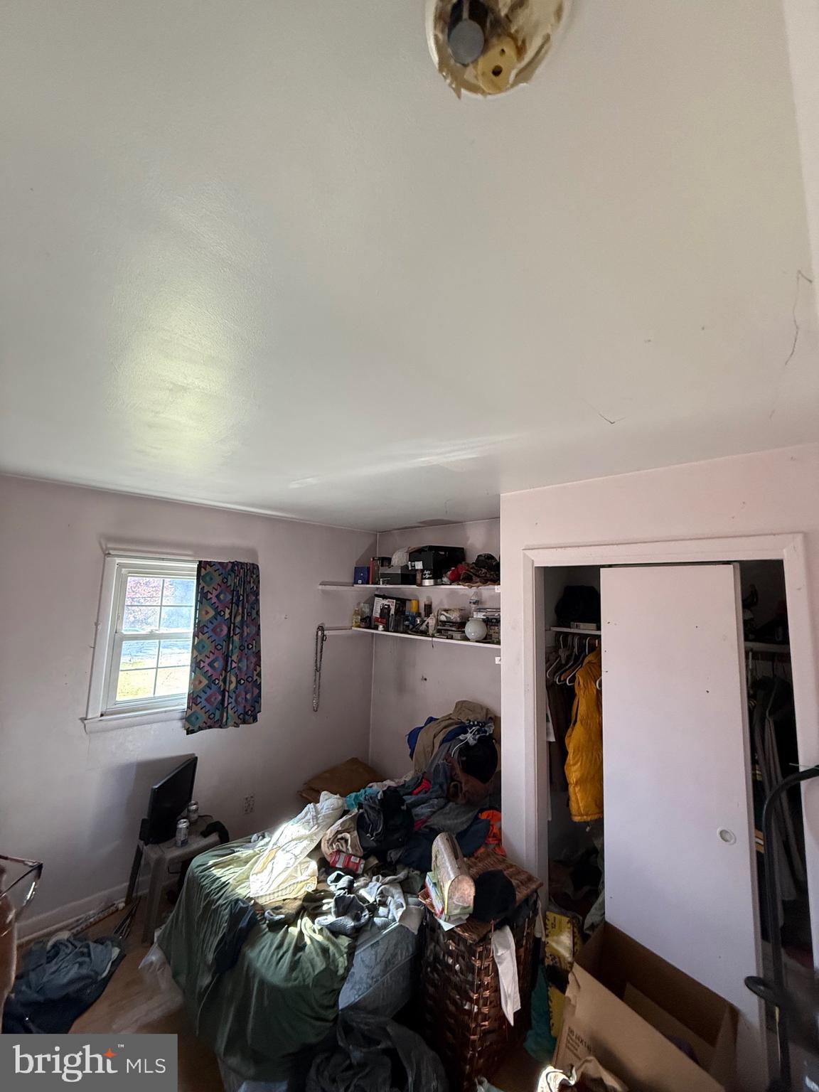 1400 Spencerville Road Spencerville, MD 20868 - Photo 10 of 16 a bedroom with bed and a window