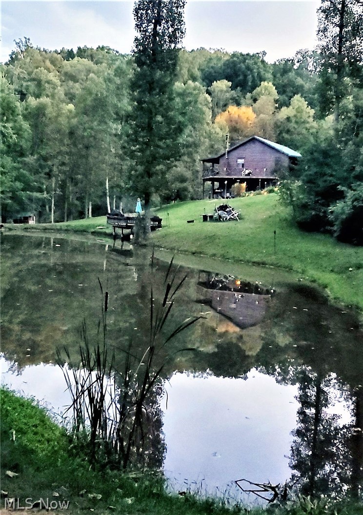 952 Paddle Run Road Mineral Wells, WV 26150 - Photo 2 of 29 Pond & house in summer (provided by seller)