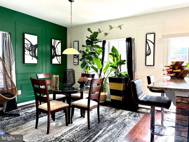 a dining room with furniture a window and a table