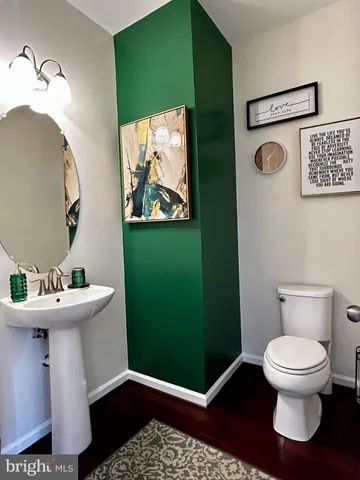 a bathroom with a toilet and a sink