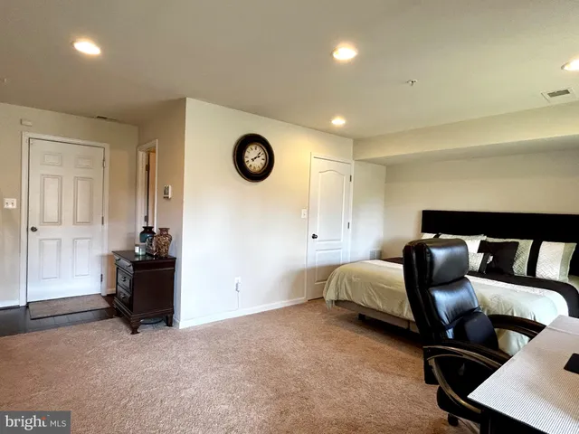 a bed room with furniture and a chair