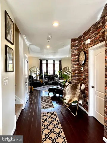 a very nice looking living room with wooden floor