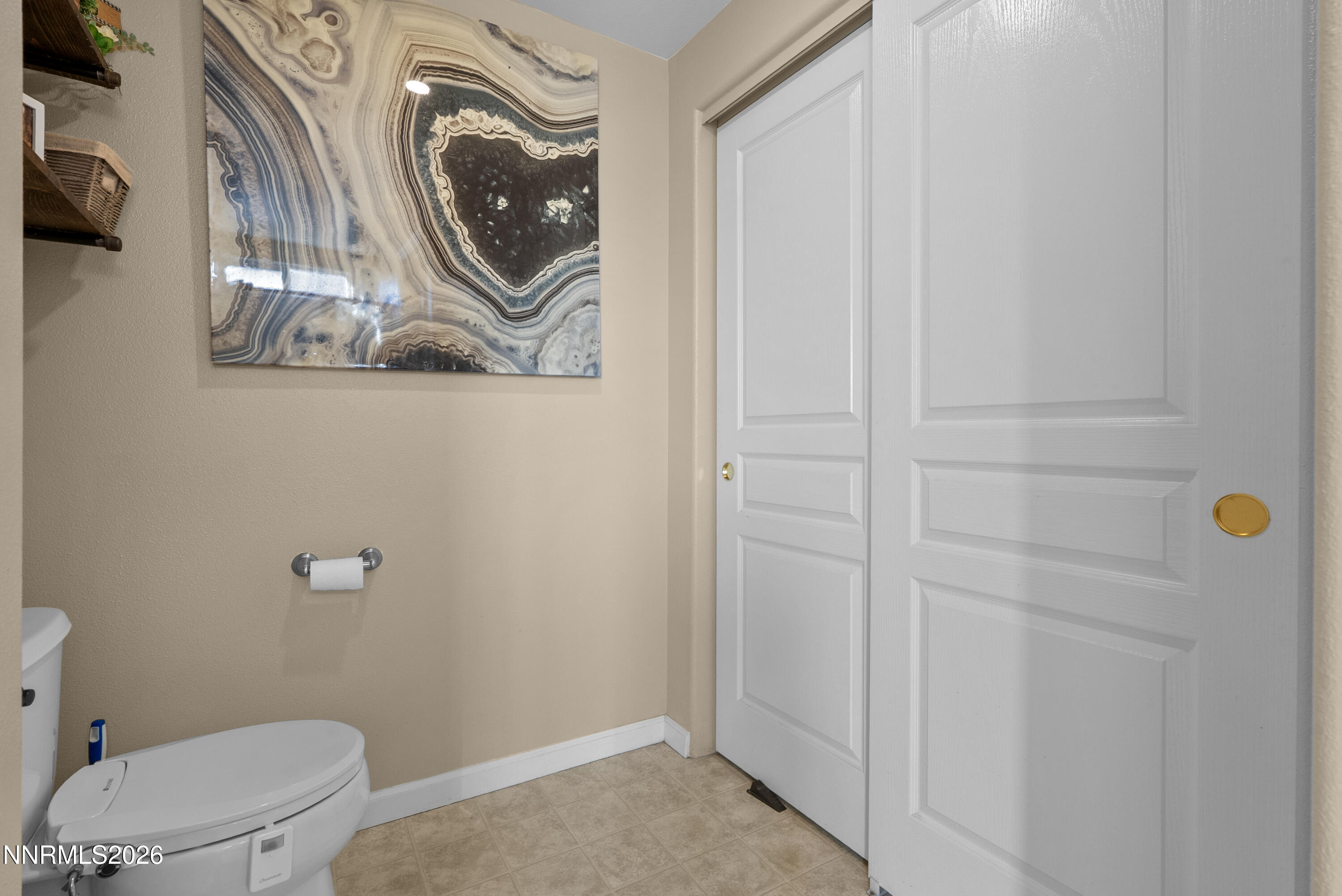552 Spur Court Fernley, NV 89408 - Photo 30 of 46 a bathroom with a toilet and a sink