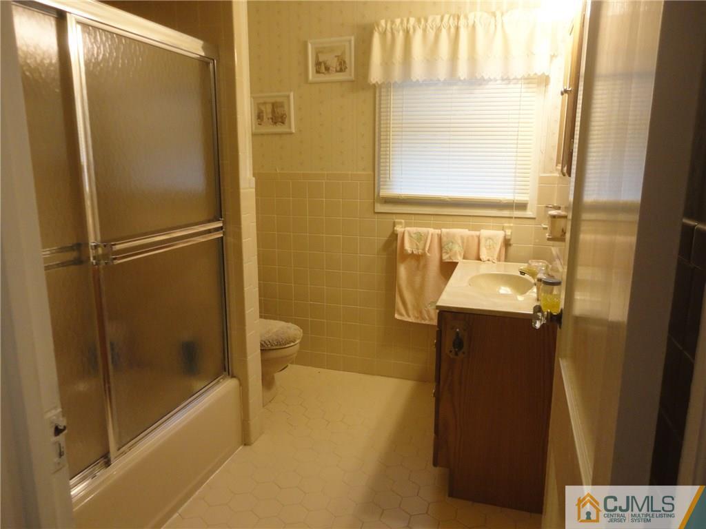 106 Walker Road West Orange, NJ 07052 - Photo 14 of 25 a bathroom with a bathtub and a shower