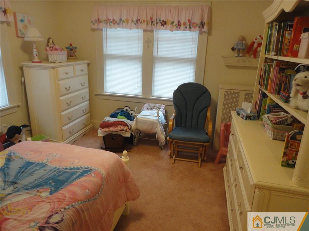 106 Walker Road West Orange, NJ 07052 - Photo 16 of 25 a bedroom with a bed and furniture